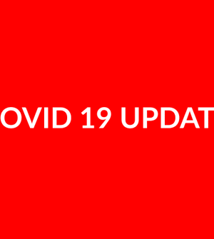 covid update on red background