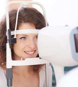 smiling woman during eye exam